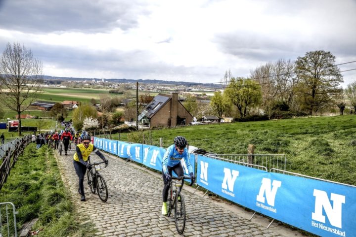 Jon Owens at the summit of the Paterberg, the severity of which is indicated by the number of riders walking up this sector